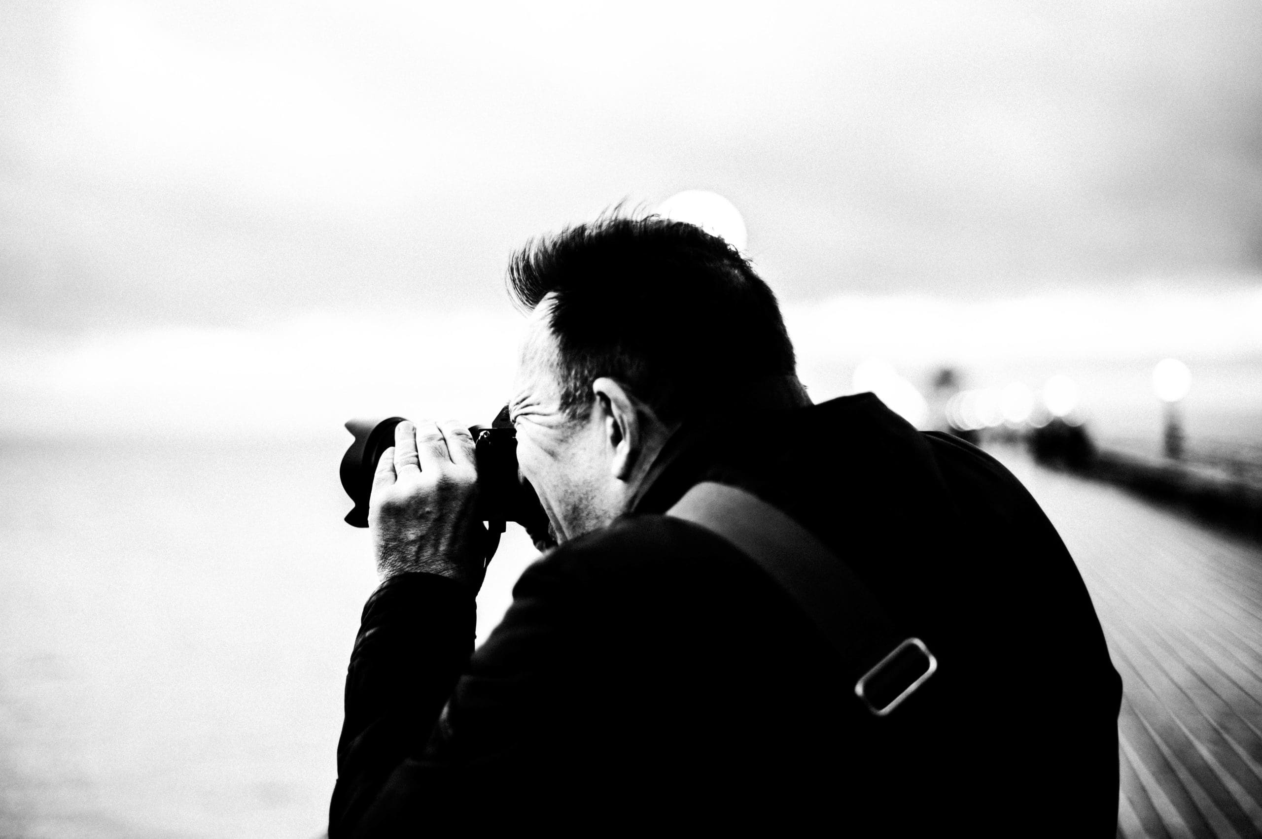 Tim Payne, Hertfordshire wedding photographer, taking photographs (Black and white)