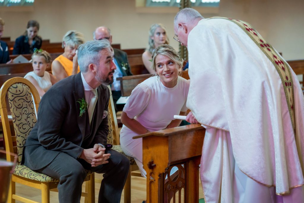 A shared moment with the Priest brings a big smile to Suzie's face