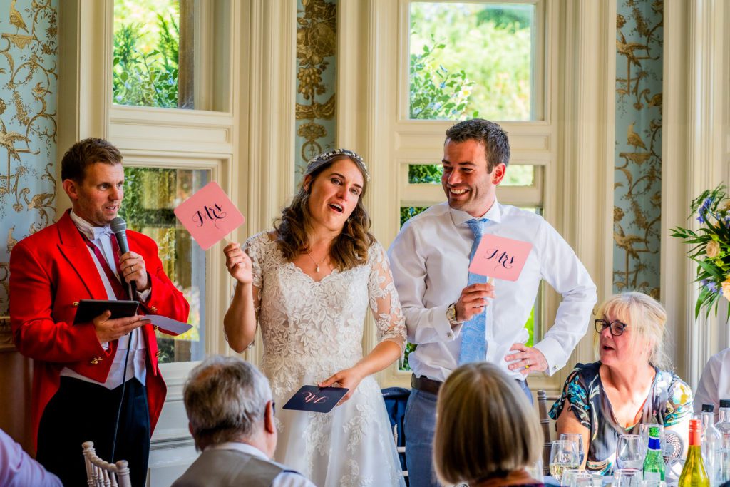 Bride and groom playing the Mr and Mrs game at Pendley Manor, Tring