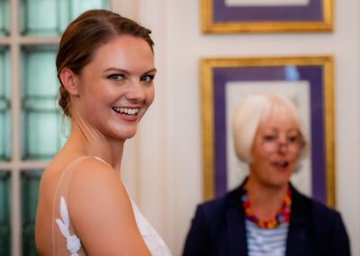 Bride at Oxford registry office smiling onto the camera, just before her wedding ceremony. Tim Payne Photography a Hertfordshire wedding photographer