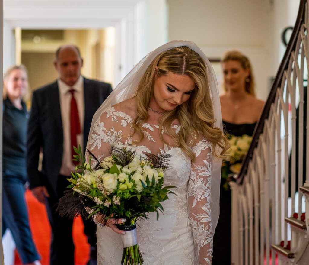 A Bride heading to her wedding ceremony in Hertford Castle. Taken by Tim Payne Photography