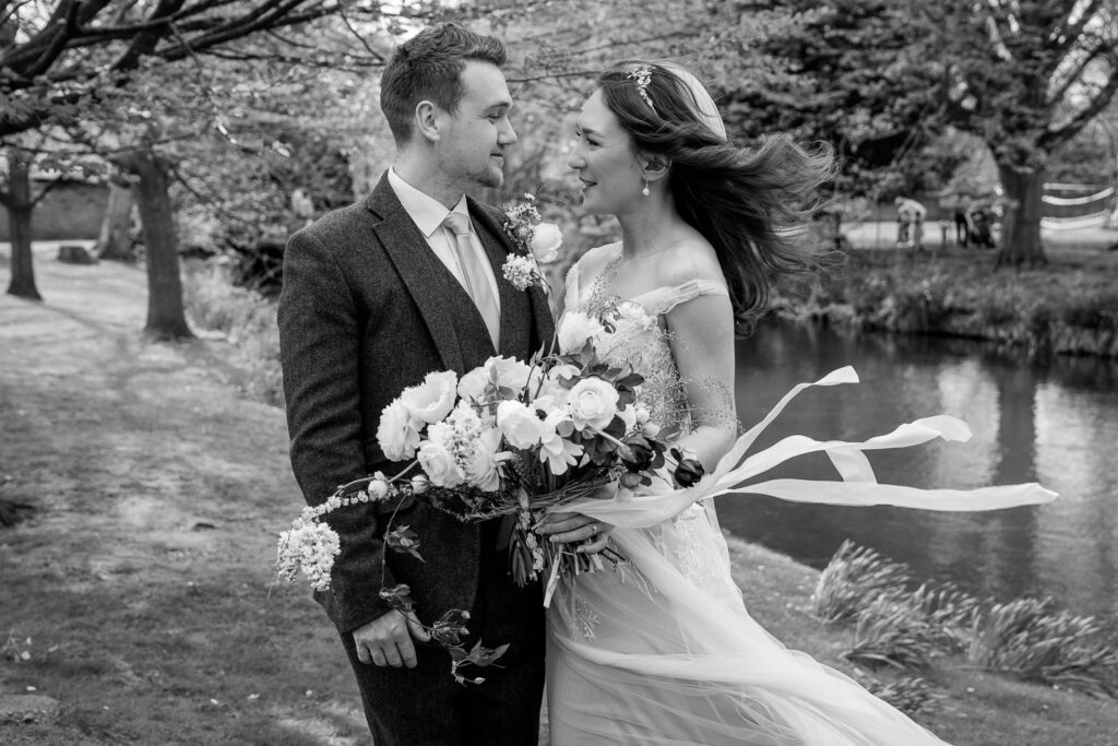 Bride and groom just married at Hertford Castle. Black and White image