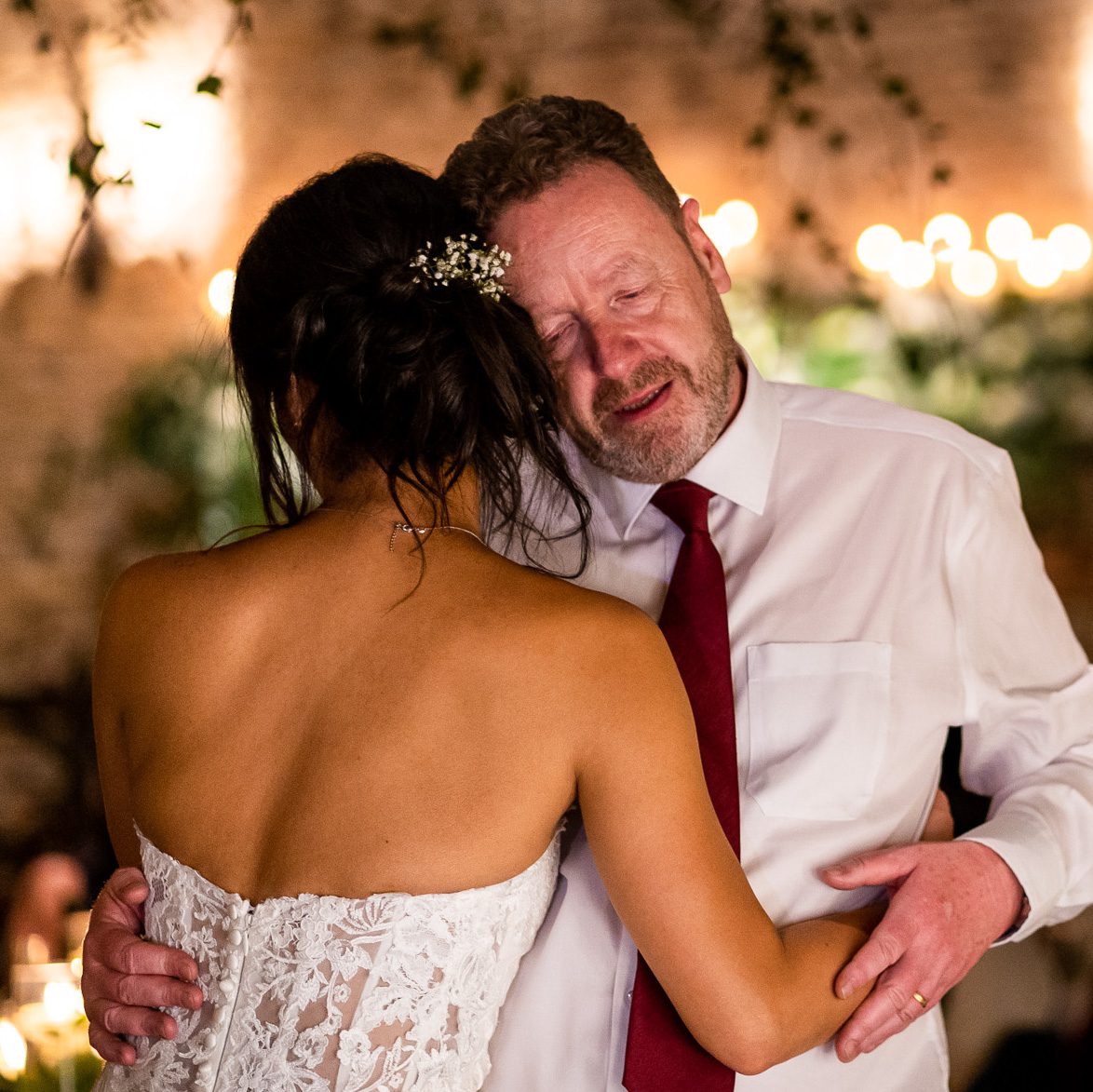 award-winning wedding photographer - a bride has a dance with her emotional dad