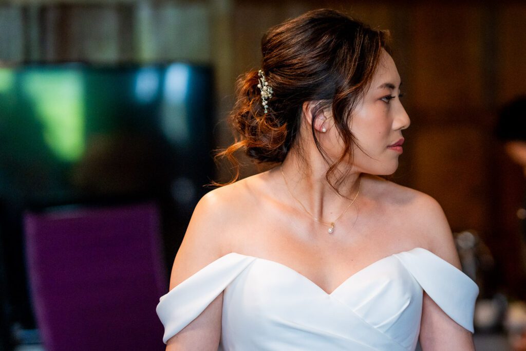 Cindy, a bride at Fanhams Hall having just finished getting ready. A beautiful head and shoulder portrait. Tim Payne Photography a Hertford wedding photographer