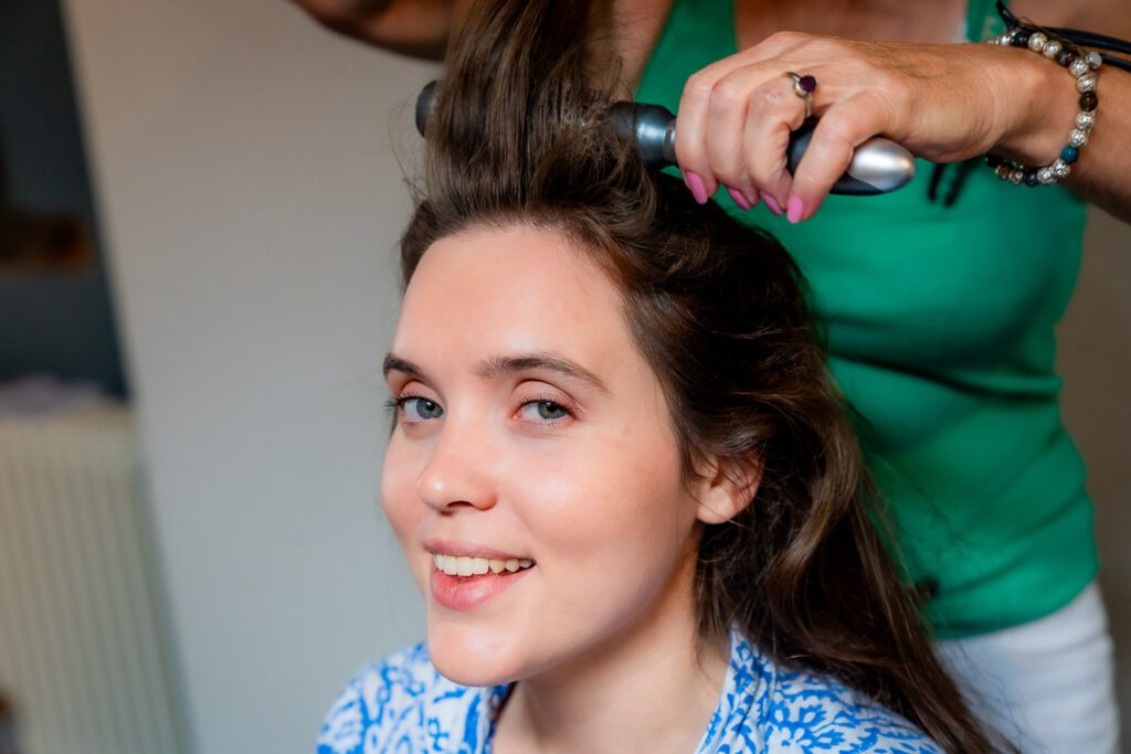 Bride in the early stages of her hair and make up before her wedding. Tim Payne photography, a Hertfordshire based wedding photographer