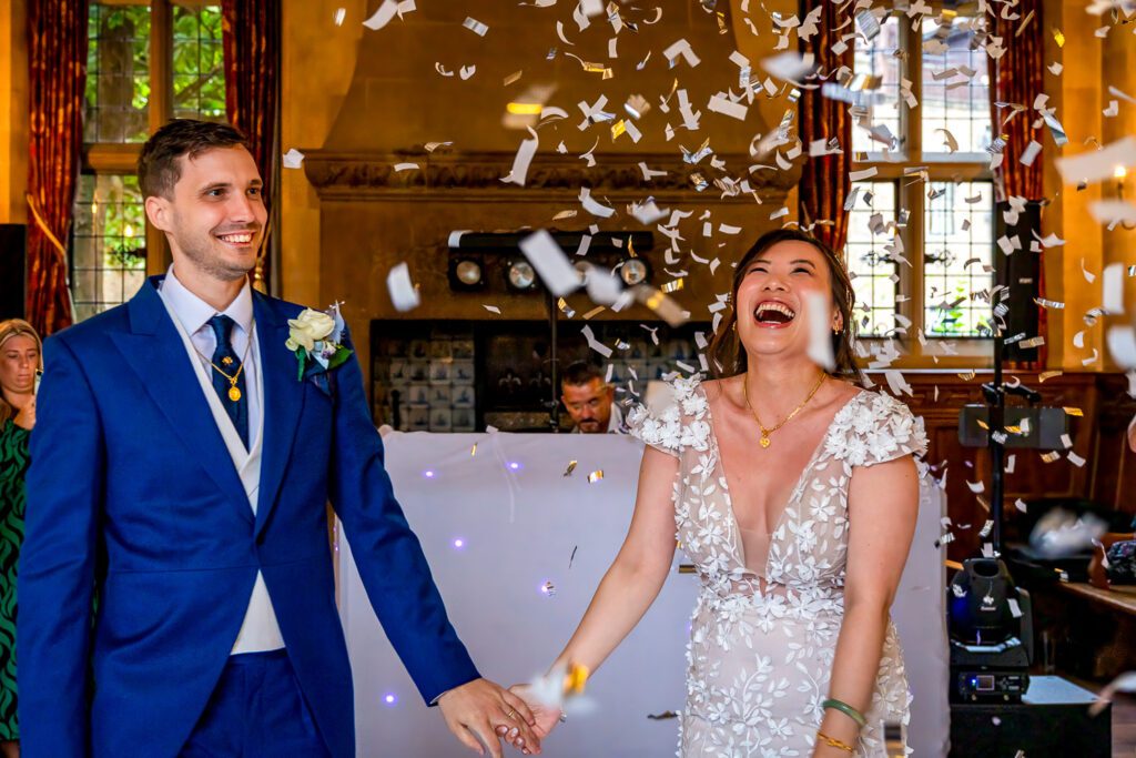 Confetti cannon gos off at the end of this Bride and Groom's first dance at Fanhams hall Ware. Taken by Tim Payne Photography a Hertford wedding photographer