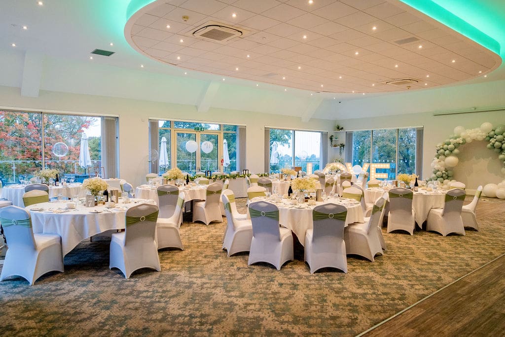 The Grange Suite at Brickendon Grange wedding venue set up for a wedding reception in pale green, white and silver