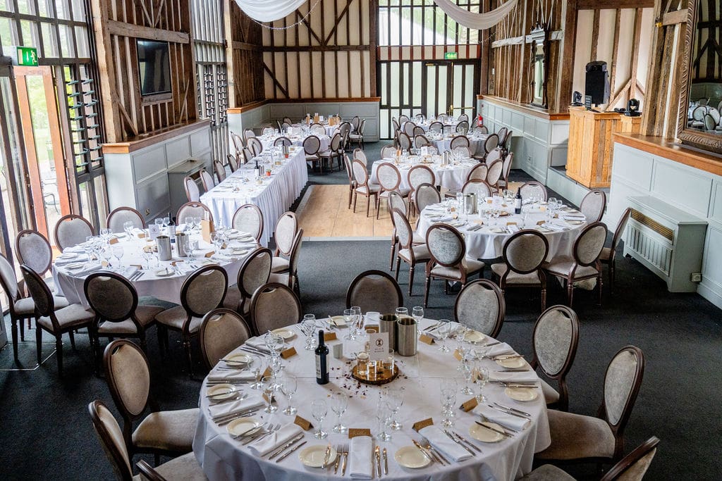 Essendon Country Club wedding venue inside the beamed great bar, the tables are simply dressed for a contemporary wedding