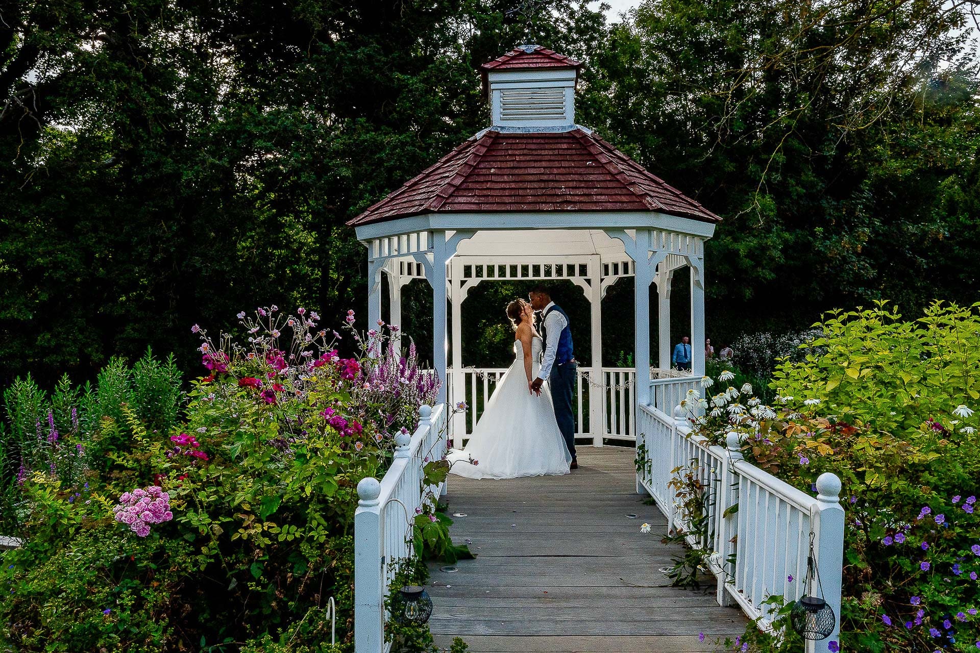Malwina and Yanick, kissing at a wedding venue in Royston, Hertfordshire.  Tim Payne a Hertfordshire wedding Photographer